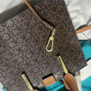 Brand new Calvin Klein purse with leather shoulder strap!( beautiful)